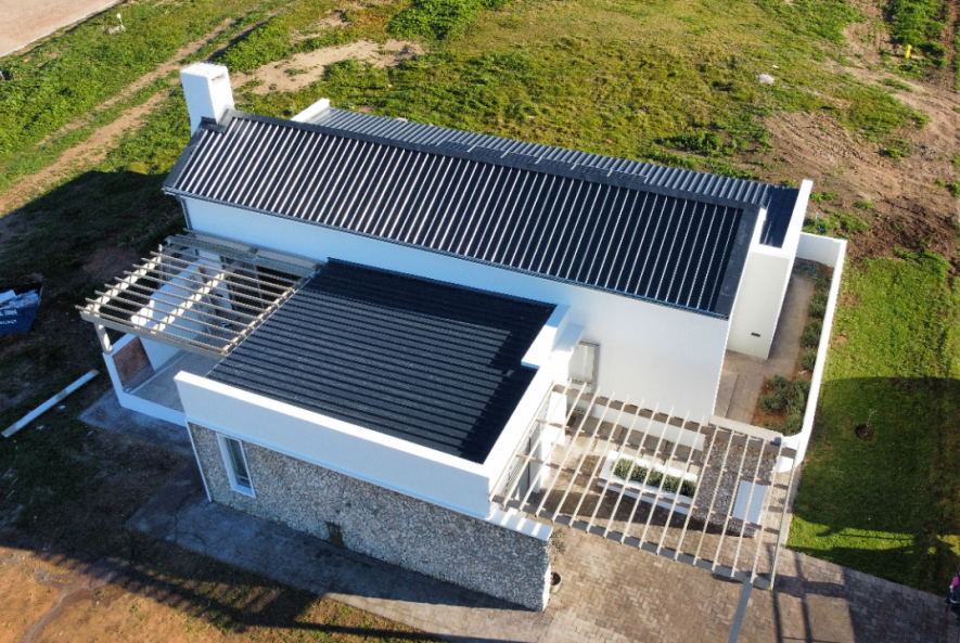 A Cape Town residential roof being sealed with waterproofing paint to protect against heavy winter rains.