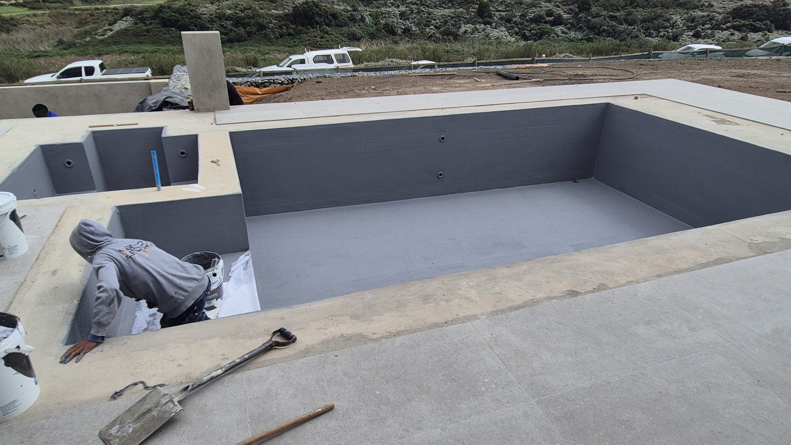Weatherbond Enhance mixed with cement used to improve tile adhesion on waterproofed pool surfaces.