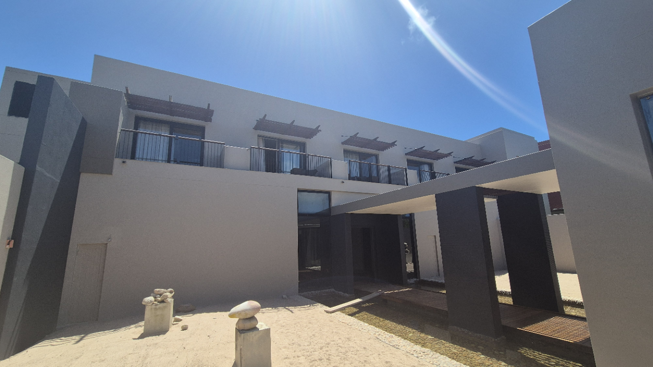 WeatherPrufe team preparing hotel exterior at Oubaai Golf Estate for repaint and waterproofing.