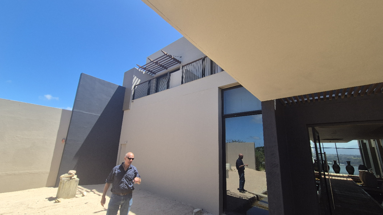 Completed exterior showing consistent Weatherseal coating and professional finish on Oubaai Golf Estate Hotel.