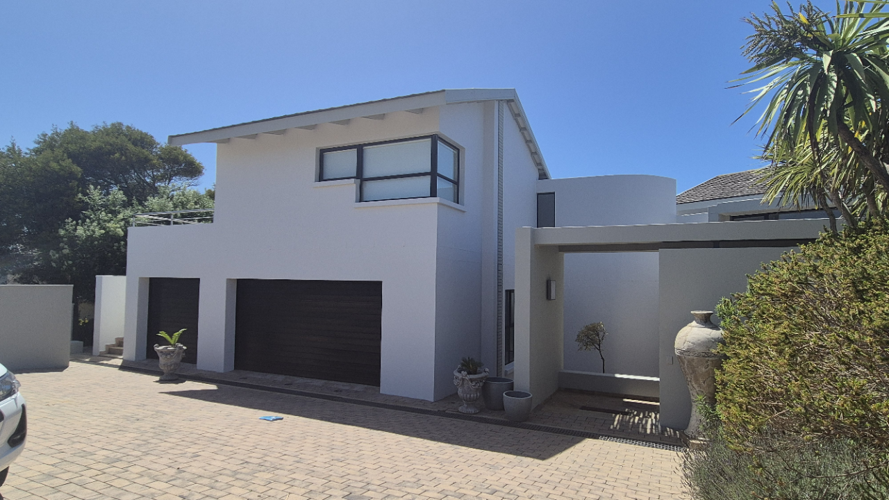 View of freshly coated exterior wall after Weatherseal application with uniform colour and protective finish suitable for coastal weather.
